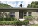 Charming home's entrance is framed by manicured shrubbery and adorned with decorative window decals at 1086 Wickerwood St, Ocoee, FL 34761