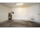 Functional garage space features utility sink, concrete floor and water heater at 1086 Wickerwood St, Ocoee, FL 34761