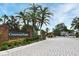 Crestwood Heights gated entrance with brick pillars, mature trees, and paved road at 1086 Wickerwood St, Ocoee, FL 34761