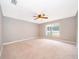 Spacious bedroom with carpet and natural light from the window at 1115 Marni Ridge Ct, Kissimmee, FL 34747