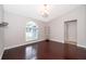 Dining area with hardwood floors, large window, and stylish chandelier at 1115 Marni Ridge Ct, Kissimmee, FL 34747