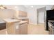Bright kitchen with light wooden cabinets and stainless steel appliances at 1115 Marni Ridge Ct, Kissimmee, FL 34747