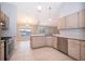 Bright kitchen with light wooden cabinets, stainless steel appliances, and tile flooring at 1115 Marni Ridge Ct, Kissimmee, FL 34747