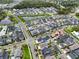 Expansive aerial view of a Primary-planned community with ponds, manicured lawns, and stylish single-Gathering homes at 1206 Civitas Way, Winter Garden, FL 34787