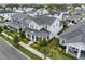 Aerial view of a traditionally styled two-story home with a manicured front lawn and backyard area at 1206 Civitas Way, Winter Garden, FL 34787
