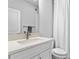 Clean bathroom featuring a modern vanity, a rectangular sink, and a shower with white curtain at 1206 Civitas Way, Winter Garden, FL 34787