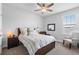 Cozy bedroom with a comfortable bed, neutral color palette, and plenty of natural light at 1206 Civitas Way, Winter Garden, FL 34787