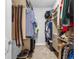 Walk-in closet with custom shelving and ample storage for clothes and accessories at 1206 Civitas Way, Winter Garden, FL 34787