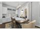 Elegant dining area with a modern chandelier, natural light, and access to an outdoor porch at 1206 Civitas Way, Winter Garden, FL 34787
