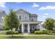 Inviting two-story home with a well-manicured lawn, showcasing a charming exterior and welcoming entrance at 1206 Civitas Way, Winter Garden, FL 34787