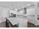 Modern kitchen featuring stainless steel appliances, a spacious island, and stylish pendant lighting at 1206 Civitas Way, Winter Garden, FL 34787