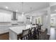 Bright, modern kitchen featuring a large island with bar seating, stainless appliances, and open concept design at 1206 Civitas Way, Winter Garden, FL 34787