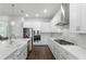 Modern kitchen design with stainless steel appliances, marble counter tops, and white cabinets at 1206 Civitas Way, Winter Garden, FL 34787
