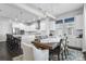 Bright, modern kitchen with stainless steel appliances, a large island, and an adjacent dining area at 1206 Civitas Way, Winter Garden, FL 34787