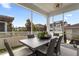Screened patio featuring a dining table, woven chairs, and view of the neighborhood at 1206 Civitas Way, Winter Garden, FL 34787