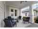 Relaxing covered porch with comfortable seating, perfect for enjoying outdoor living and entertaining at 1206 Civitas Way, Winter Garden, FL 34787