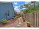 Backyard with mulch pathway and privacy fence at 1407 S Palmetto Ave, Sanford, FL 32771