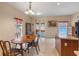 Open dining room with a breakfast bar, double doors and a decorative chandelier at 1407 S Palmetto Ave, Sanford, FL 32771