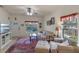 Bright living room with large windows, tile floors, and comfortable seating at 1407 S Palmetto Ave, Sanford, FL 32771