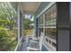 Cozy screened porch with rocking chairs at 1407 S Palmetto Ave, Sanford, FL 32771