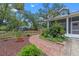 Landscaped side yard with potted plants at 1407 S Palmetto Ave, Sanford, FL 32771