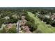 Aerial view of a residential area featuring lush trees, green spaces, and community features at 154 Golf Club Dr # 154, Longwood, FL 32779