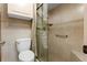 Tiled bathroom features a toilet and glass shower with built in shower seating at 154 Golf Club Dr # 154, Longwood, FL 32779