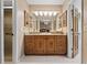 The bathroom features a granite vanity, a makeup mirror, and decorative light fixtures at 154 Golf Club Dr # 154, Longwood, FL 32779