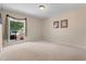 This cozy bedroom offers soft carpet, natural light, and is perfect for relaxation or as a guest room at 154 Golf Club Dr # 154, Longwood, FL 32779