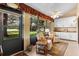 Bright Florida room featuring a ceiling fan, seating and backyard access at 154 Golf Club Dr # 154, Longwood, FL 32779
