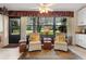 Cozy Florida room with serene backyard views and comfortable seating at 154 Golf Club Dr # 154, Longwood, FL 32779