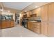 Spacious kitchen featuring tile floors, wood cabinets and stainless appliances at 154 Golf Club Dr # 154, Longwood, FL 32779
