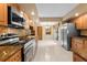 Well-lit kitchen with stainless steel appliances and breakfast area at 154 Golf Club Dr # 154, Longwood, FL 32779