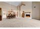 Open living room with fireplace, ceiling fan and adjacent dining area at 154 Golf Club Dr # 154, Longwood, FL 32779