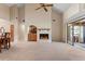 Bright living room with a white brick fireplace and vaulted ceilings at 154 Golf Club Dr # 154, Longwood, FL 32779