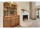 Cozy living room featuring a stylish fireplace, wet bar, and access to a bright outdoor space at 154 Golf Club Dr # 154, Longwood, FL 32779