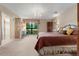 Spacious main bedroom with a large window overlooking the well maintained yard and an en suite bathroom at 154 Golf Club Dr # 154, Longwood, FL 32779