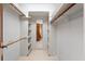 Spacious walk-in closet with built-in shelving and ample storage space for clothing and accessories at 154 Golf Club Dr # 154, Longwood, FL 32779