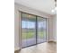 Sliding glass doors opening to a fenced backyard with a patio at 16164 Point Rock Dr, Winter Garden, FL 34787