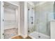 Bathroom featuring walk-in shower and entry to walk-in closet with shelving for storage at 16164 Point Rock Dr, Winter Garden, FL 34787