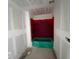Unfinished bathroom with green tub and red waterproofing on the walls at 1646 Cane Bamboo Drive, St Cloud, FL 34771