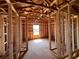 Unfinished bedroom featuring exposed ceiling beams and window with bright natural light at 1646 Cane Bamboo Drive, St Cloud, FL 34771