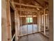 Unfinished bedroom featuring exposed ceiling beams and window with view to the outdoors at 1646 Cane Bamboo Drive, St Cloud, FL 34771