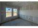A bedroom under construction with bare walls and windows, offering a blank canvas for customization at 1646 Cane Bamboo Drive, St Cloud, FL 34771