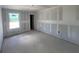 Unfinished bedroom showcasing drywall, window, and doorway at 1646 Cane Bamboo Drive, St Cloud, FL 34771