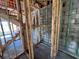 Interior under construction showing wood framing, concrete blocks, and unfinished staircase at 1646 Cane Bamboo Drive, St Cloud, FL 34771
