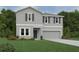 Charming two-story home with light gray siding, dark shutters, manicured lawn, and a two-car garage at 1646 Cane Bamboo Drive, St Cloud, FL 34771