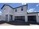 View of a two-story, newly constructed home with an attached three car garage with ample parking at 1646 Cane Bamboo Drive, St Cloud, FL 34771