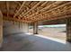 Unfinished garage with concrete flooring and an open view, perfect for customization to fit various needs at 1646 Cane Bamboo Drive, St Cloud, FL 34771
