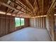 Spacious interior with exposed framework, showcasing an open floor plan and the potential for a custom design at 1646 Cane Bamboo Drive, St Cloud, FL 34771